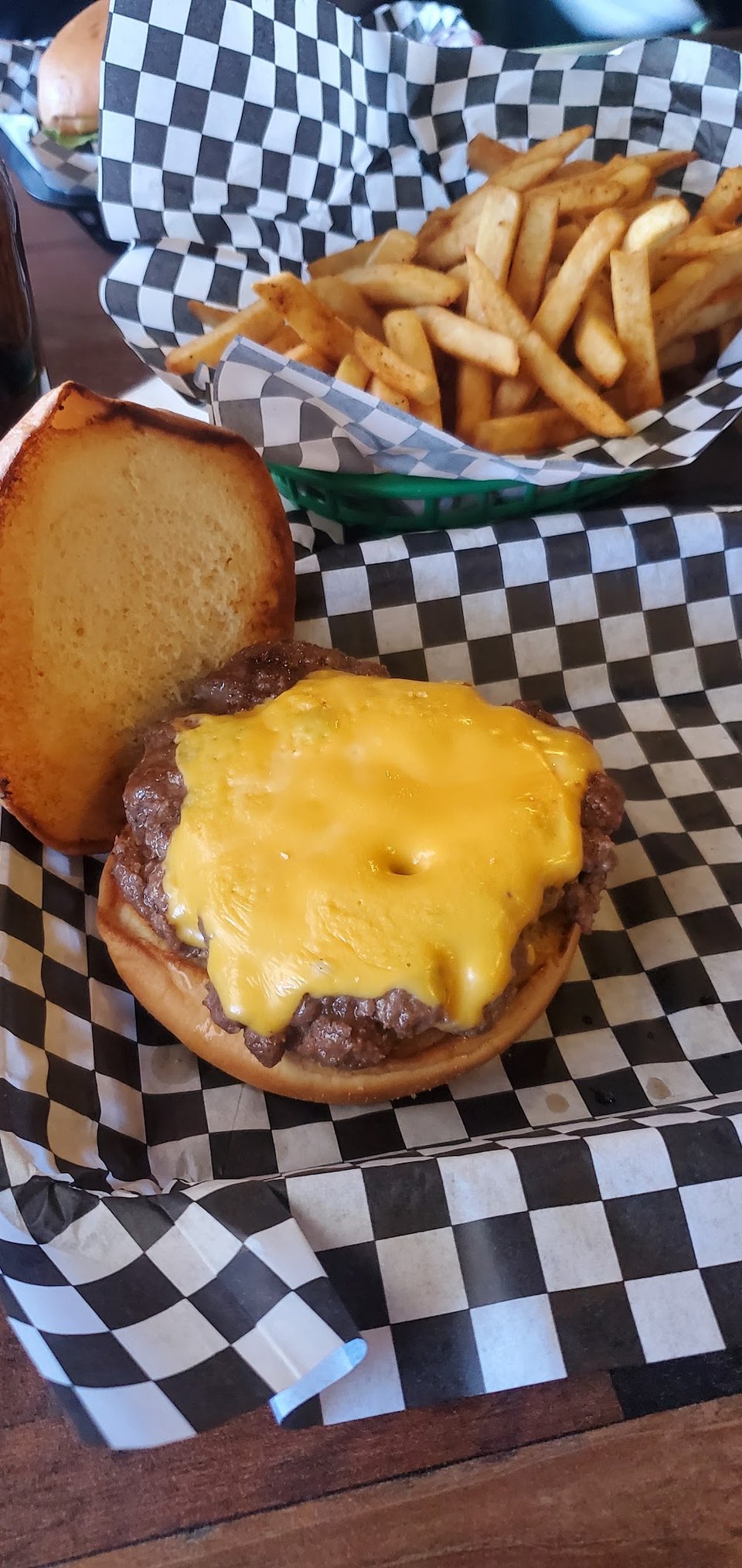 Printed menu listing burgers and sandwich-style items.