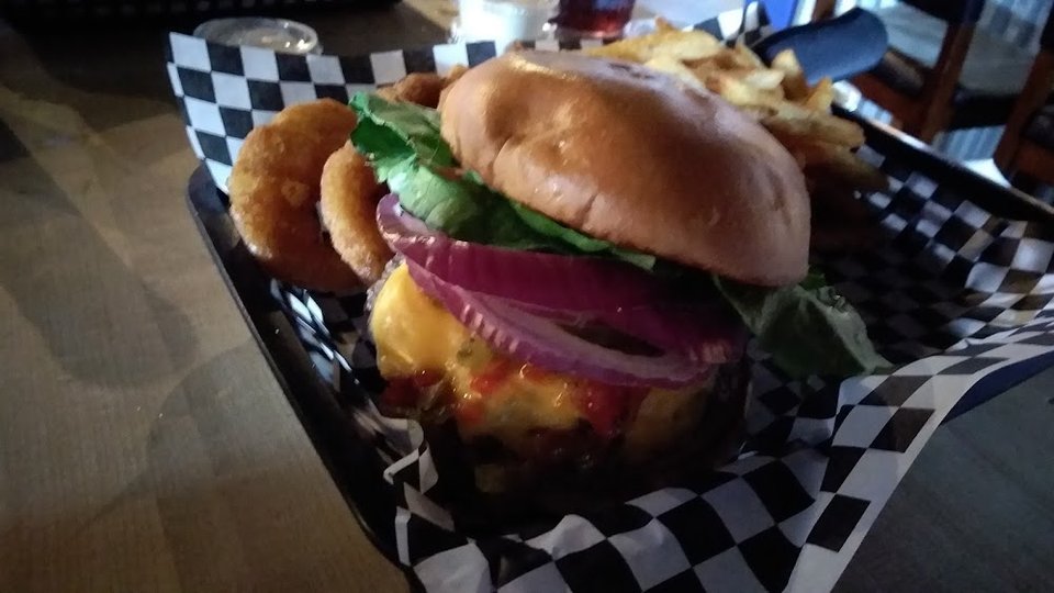 Simple bar menu with hearty burger selections.